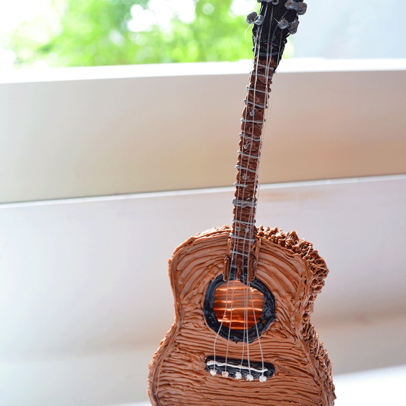 3D pen art: Guitar-shaped cake on window sill. | stencil