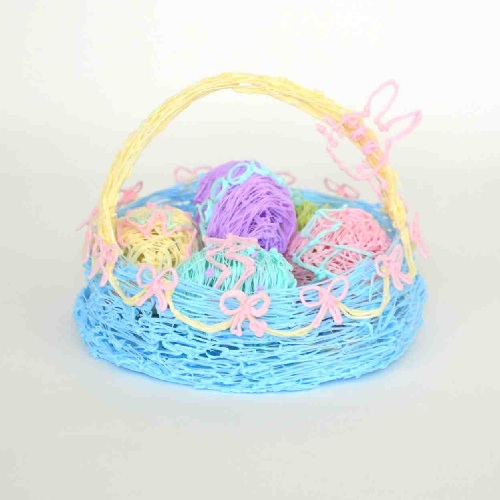 Close-up of Easter egg basket with yarn and bow: 3D pen art.