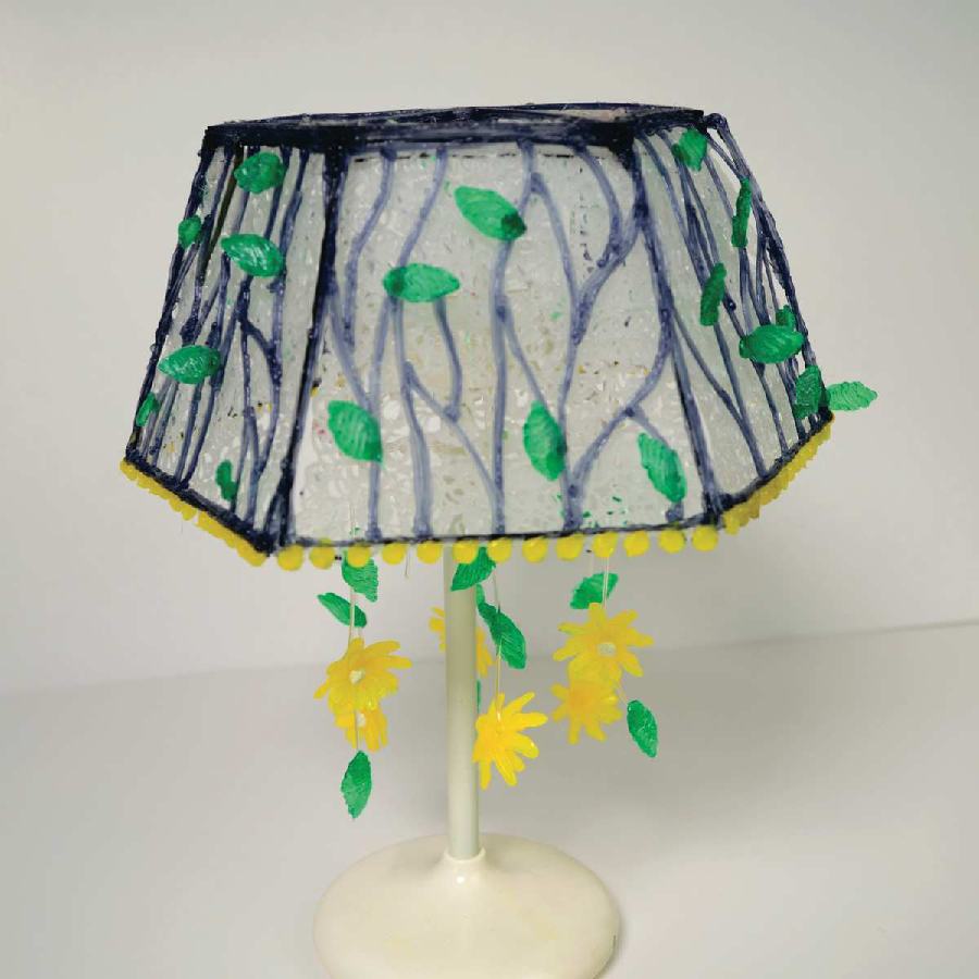 Artistic 3D pen lamp with flower shade.