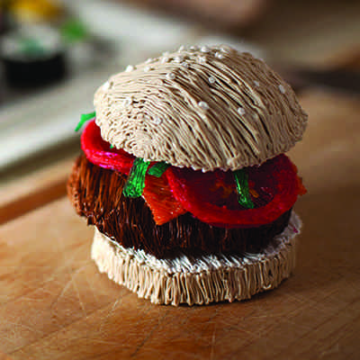 3Doodler's yarn burger on wooden board | stencil
