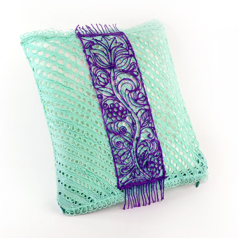 Purple and green decorative pillow with lace trim and 3D pen art. | stencil