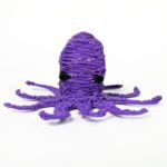 3D pen art: Purple yarn octopus with black eyes and eye