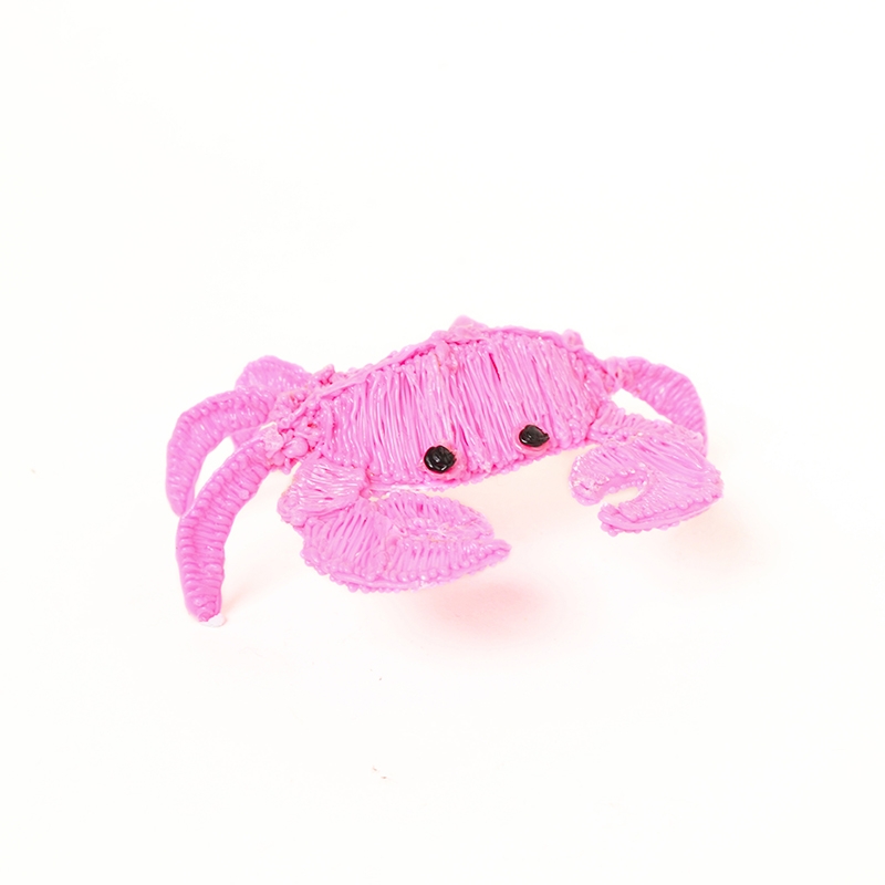 Close-up of 3D pen filament strands creating crab on white surface | stencil