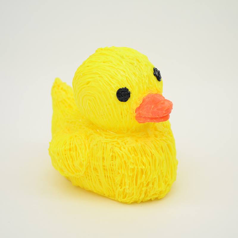 Yellow rubber ducky, orange beak, white surface; 3D pen art | stencil