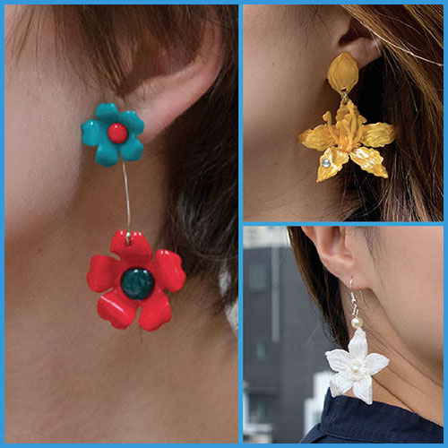 Woman wearing 3D pen art earrings in close-up | stencil