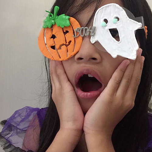 3D pen art: Girl with glasses holding Halloween masks | stencil