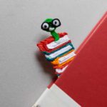 3D pen art: Bookworm toy with glasses on book