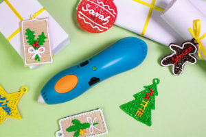 Blue stapler amidst Christmas decor - 3D pen art