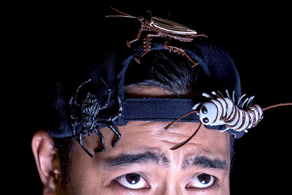 Creepy man with bug-covered hat and spider 3D pen art