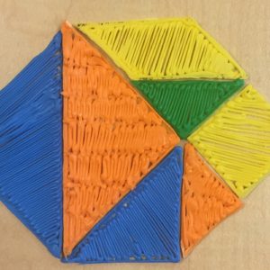 Colorful kite on table with brown background, 3D pen art.