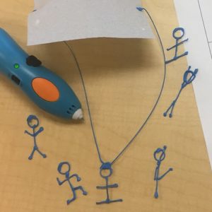 Blue 3D pen and paper with 3D drawing.