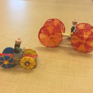 Two toy people riding toy car, 3D pen art