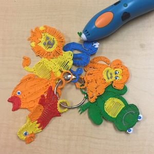 Colorful key chains with a blue 3D pen: Creative 3D pen designs on key chains.