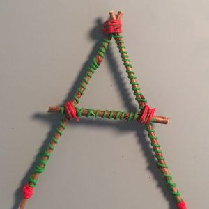 Wooden stick and rope form a small triangle 3D pen art.