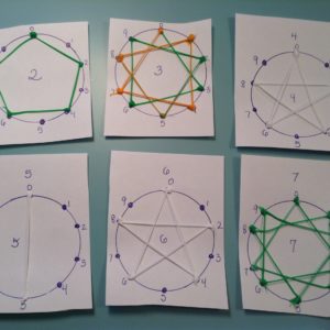 IMG_1893 - 3Doodler Close-up of colorful paper circles on blue surface 3D pen art.