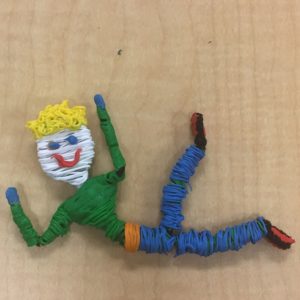 Close-up of yarn 3D pen toy figure.