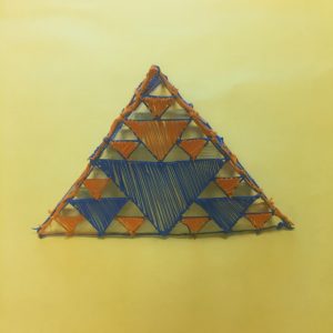 Colorful triangle crafted with string and yarn - 3D pen art