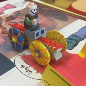 Lego man riding toy car on table with 3Doodler 3d pen art