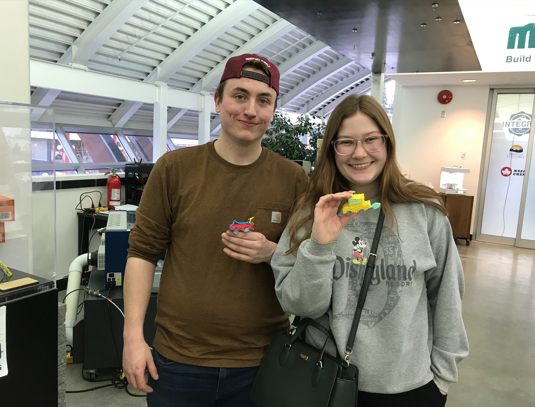 Airport travelers showcasing 3D pen luggage art