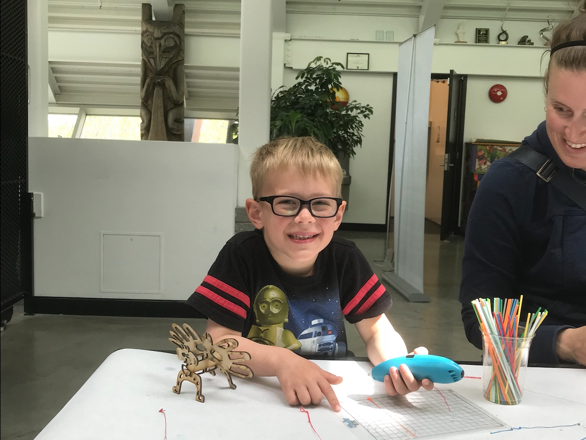 Woman & child at table with 3D pen art