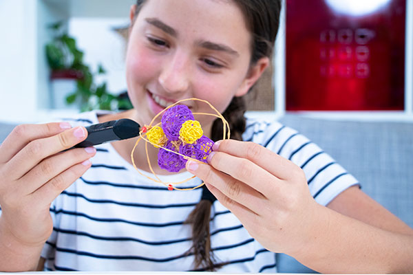 BLOG FEATURE IMAGE (SM) - 3Doodler 3D pen art: Sm girl holding flower-decorated cookie