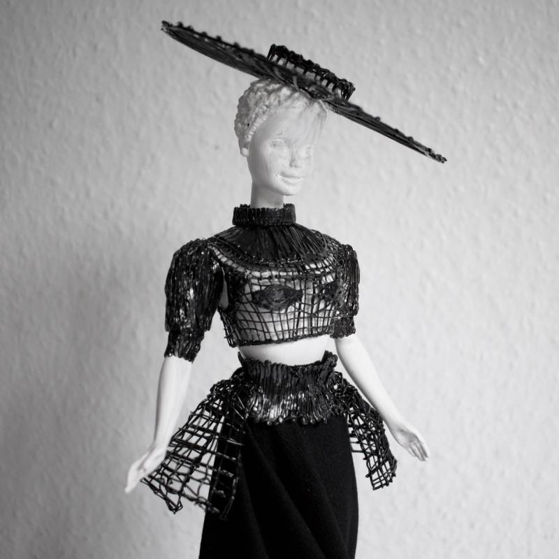3D pen art of doll in black dress and hat