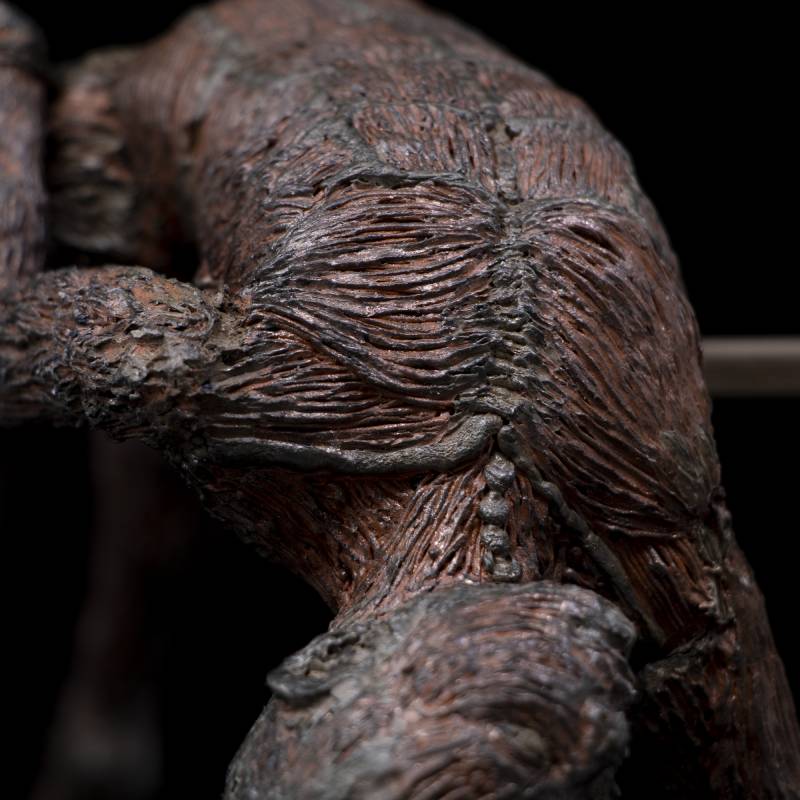 Close-up of 3D pen art: bear statue with tree trunk