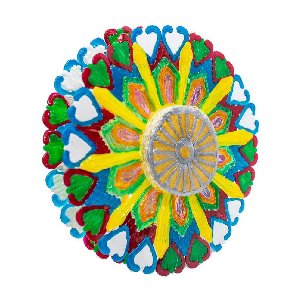 3D pen art: Brightly colored paper plate with circular design.