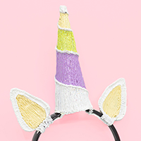 3Doodler unicorn ears with colorful horn on filament strands background. | 3D Pen Template Stencil