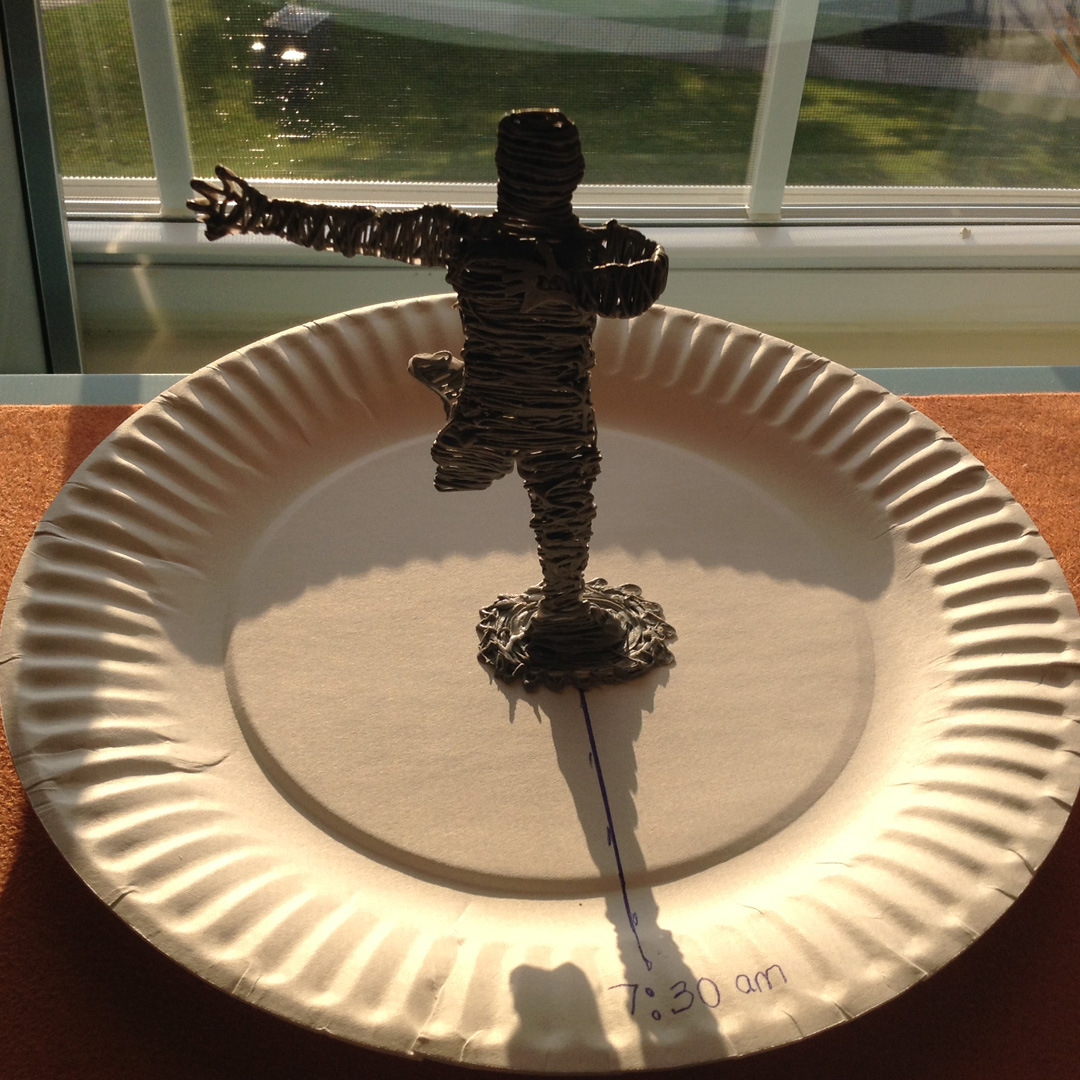 3Doodler art: Sundial giraffe cross on paper plate, made with sticks.