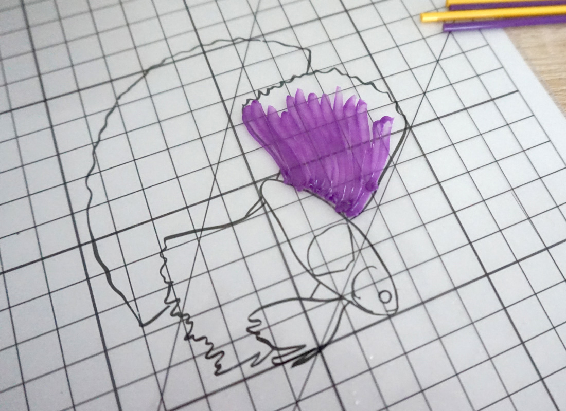 Purple flower on paper with 3D fish and man