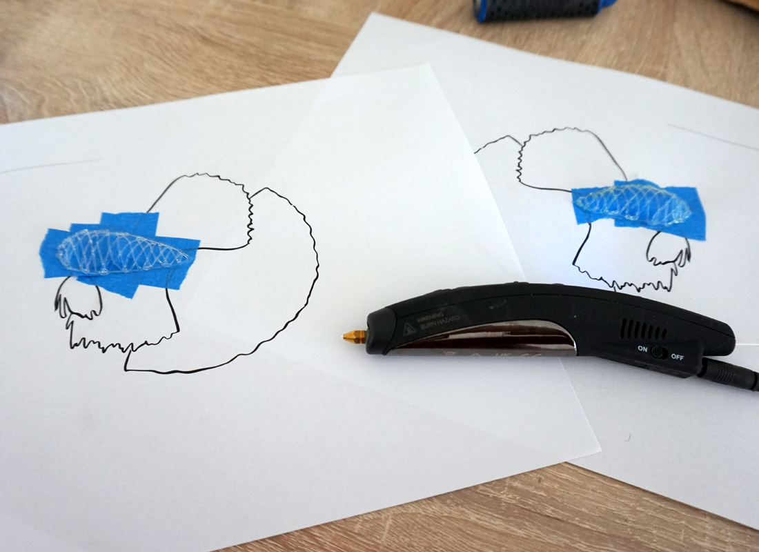 3D dog drawings on two paper pieces