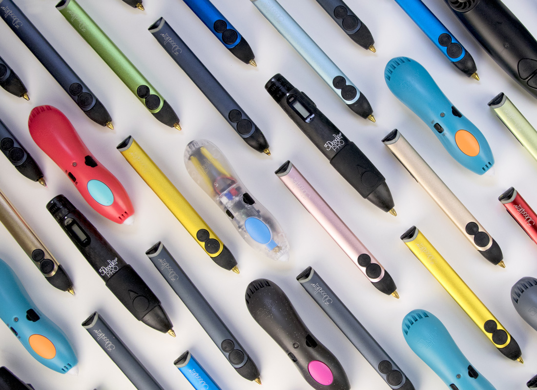 Colorful 3D pens on table, close-up