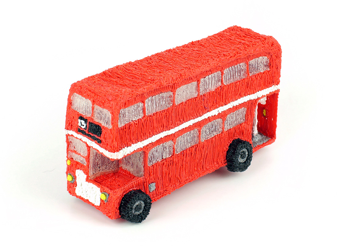 3Doodler red double decker bus cake on white surface