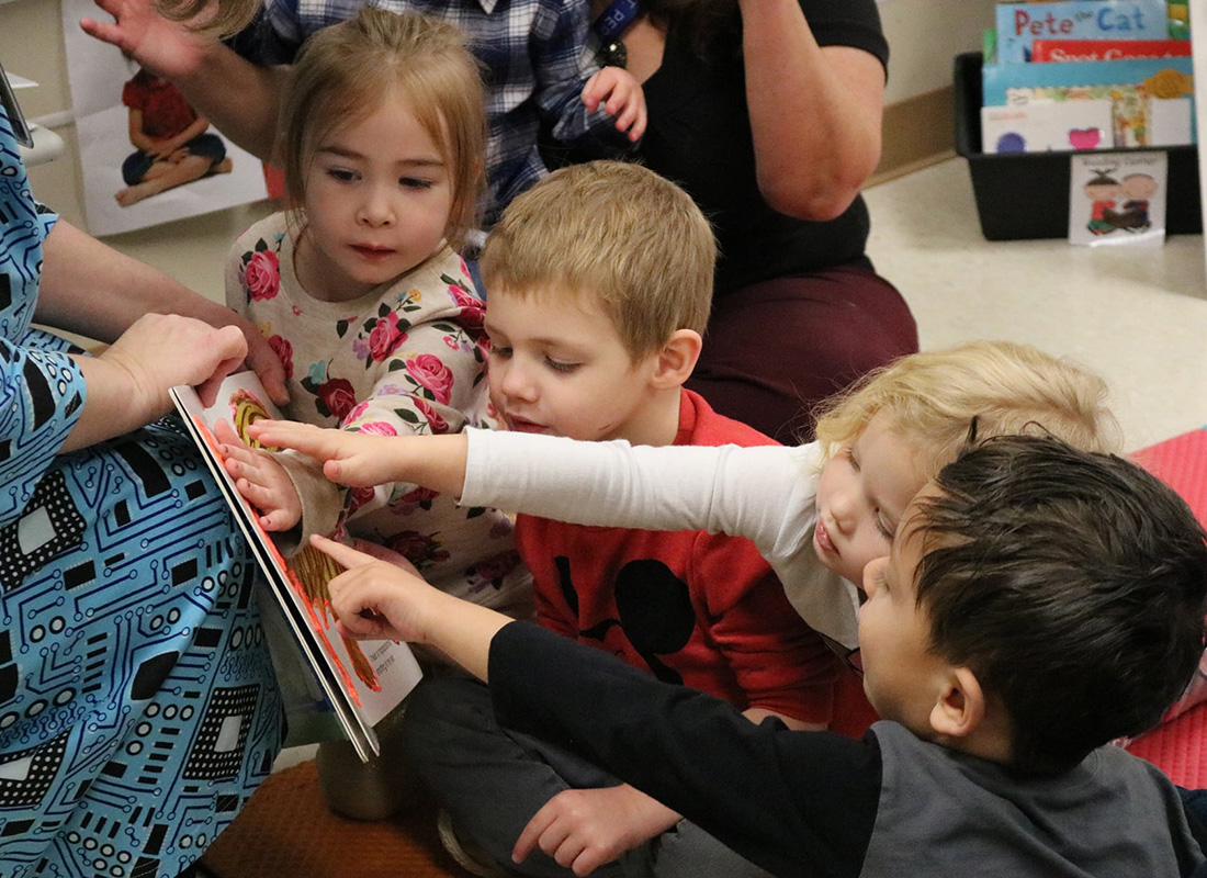 Children reading book in 3D pen art.