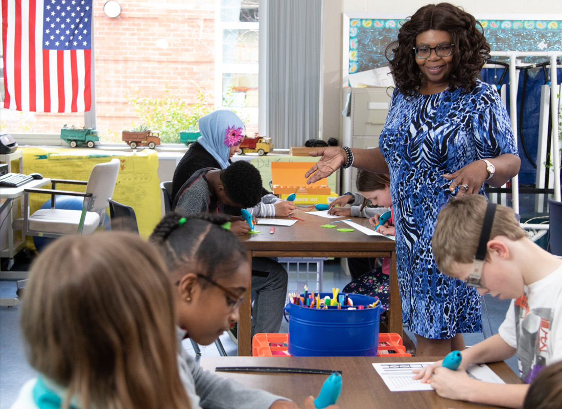 Classroom 3D pen art: Children at table.