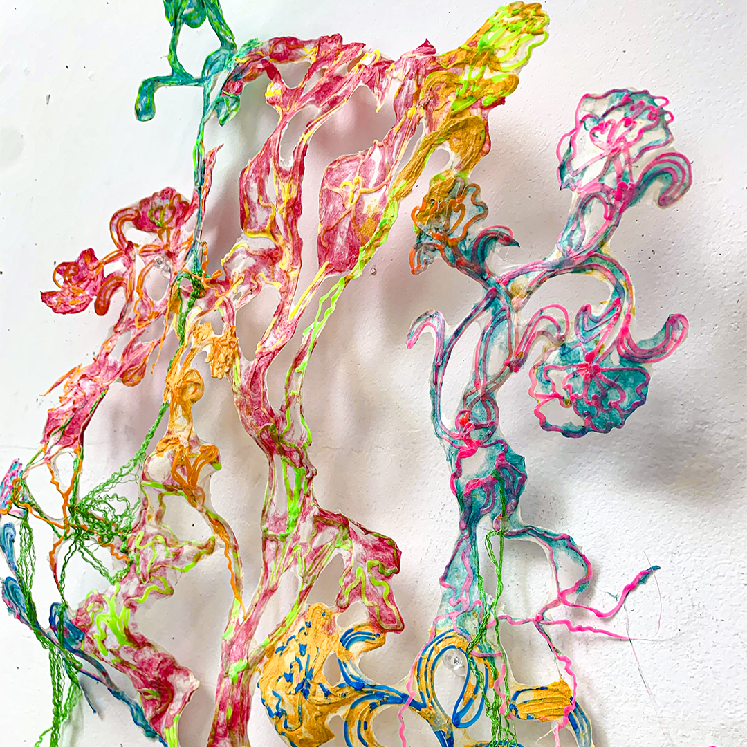 Colorful 3D pen string art hanging on wall