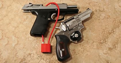 These are gun locks. For the record, you can get firearm locks FOR FREE from local law enforcement: http://www.projectchildsafe.org/