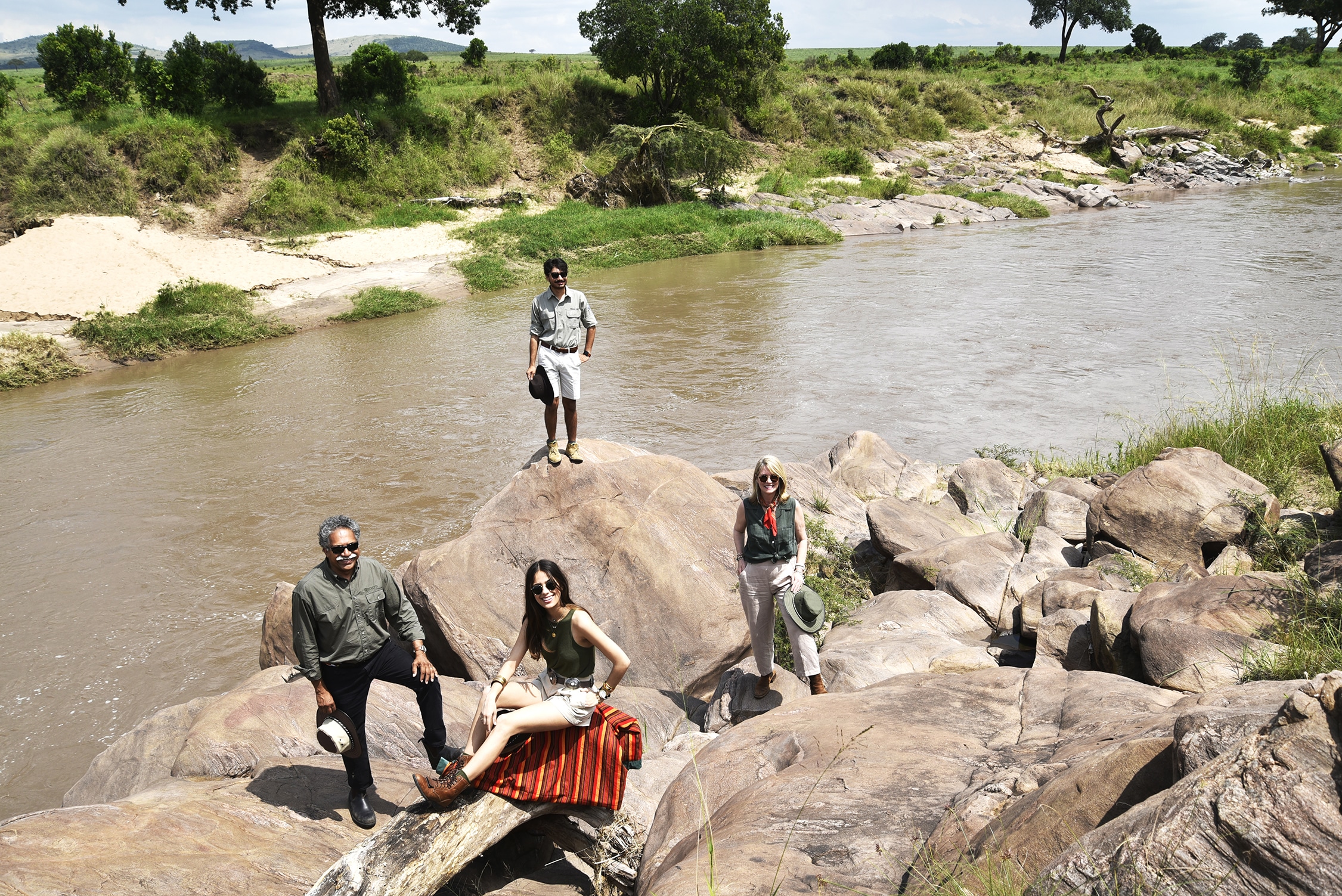 The Pintos standing by a river