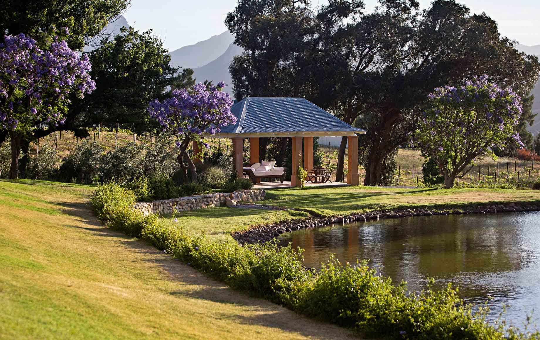 Resting benches in front of pond at Cape Winelands African Safari