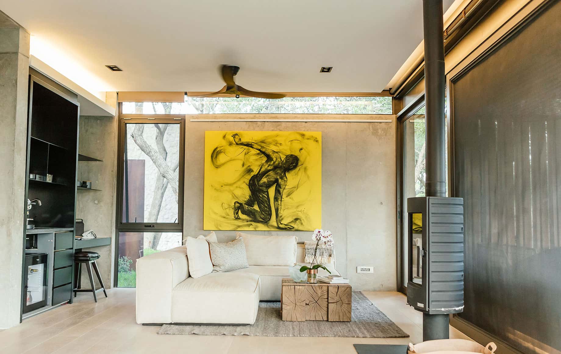 A living room with art and a fireplace