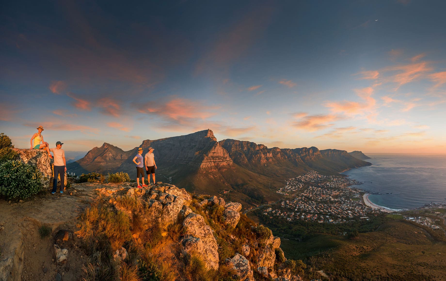 Two people standing on top of Table Mountain.