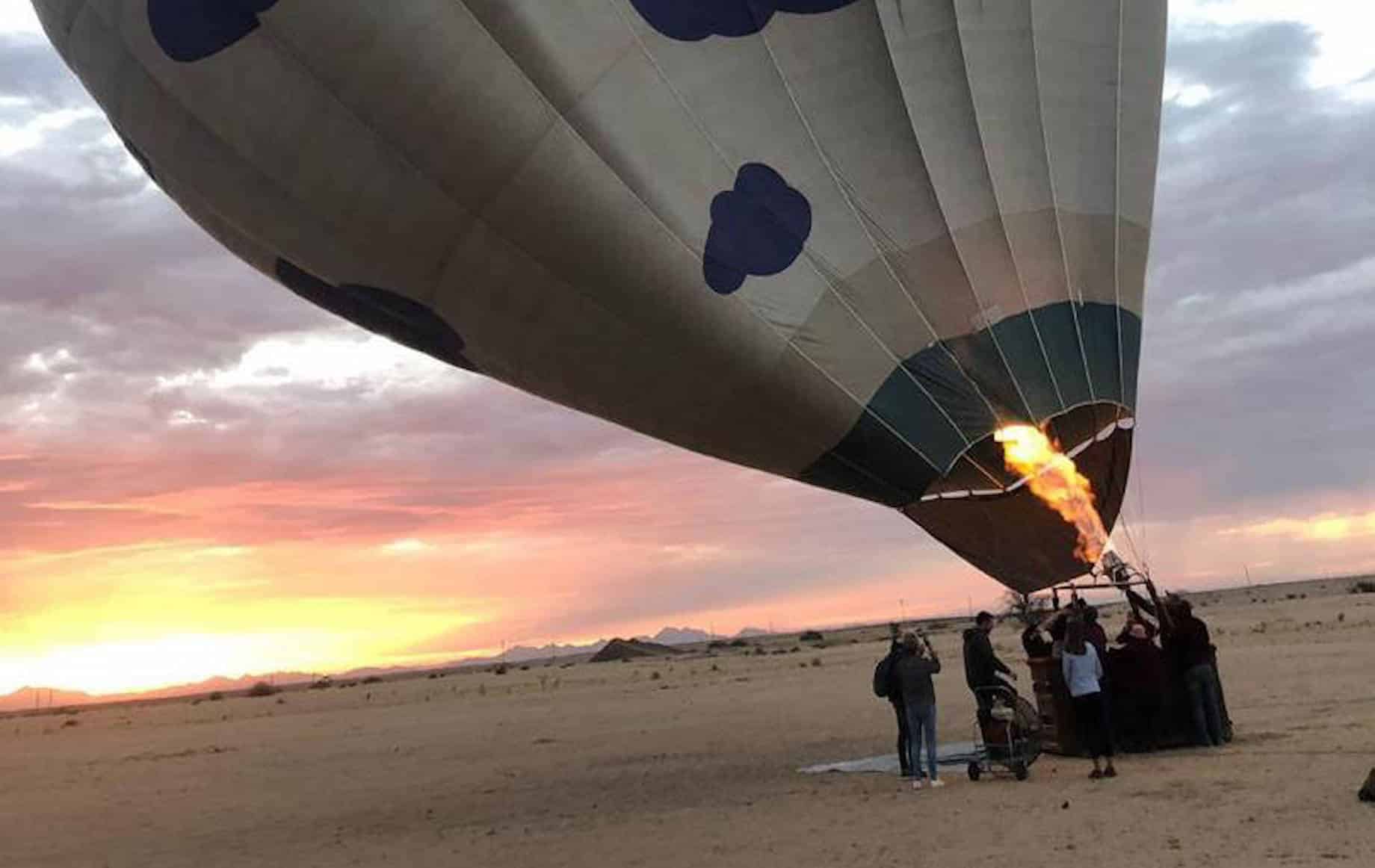 People trying to inflate hot air balloons