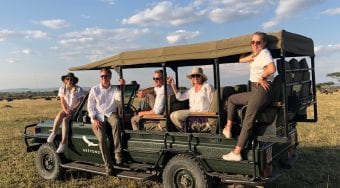 people on a jeep in the wild