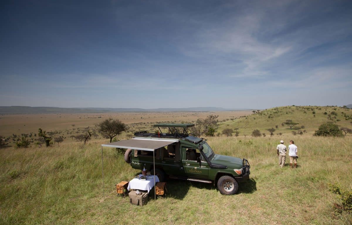 A couple taking in the view during an picnic lunch.
