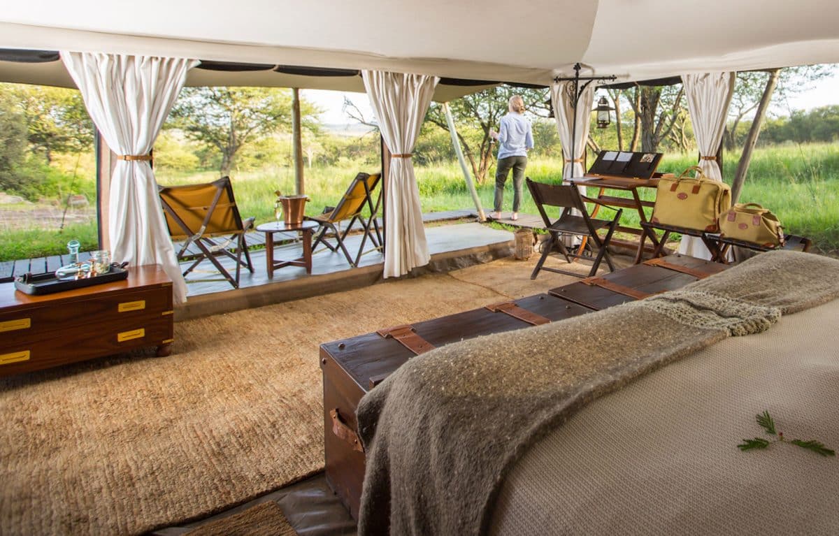 A woman admiring the view from the Serengeti Pioneer Camp.