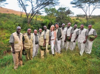 dennis and joy pinto with a group of micato safari directors