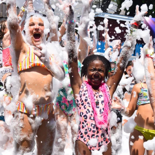 Campers playing with bubbles.