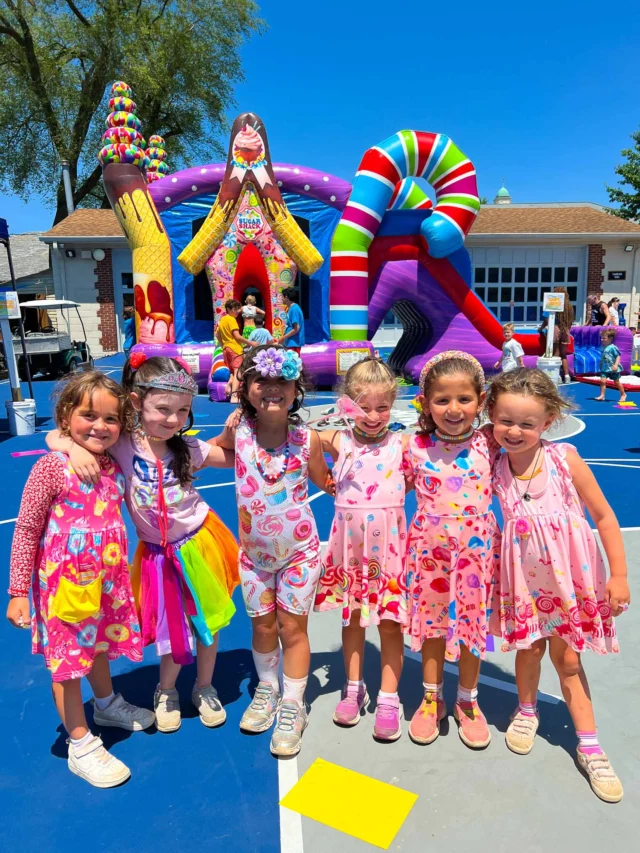 A group of young campers wearing pink.