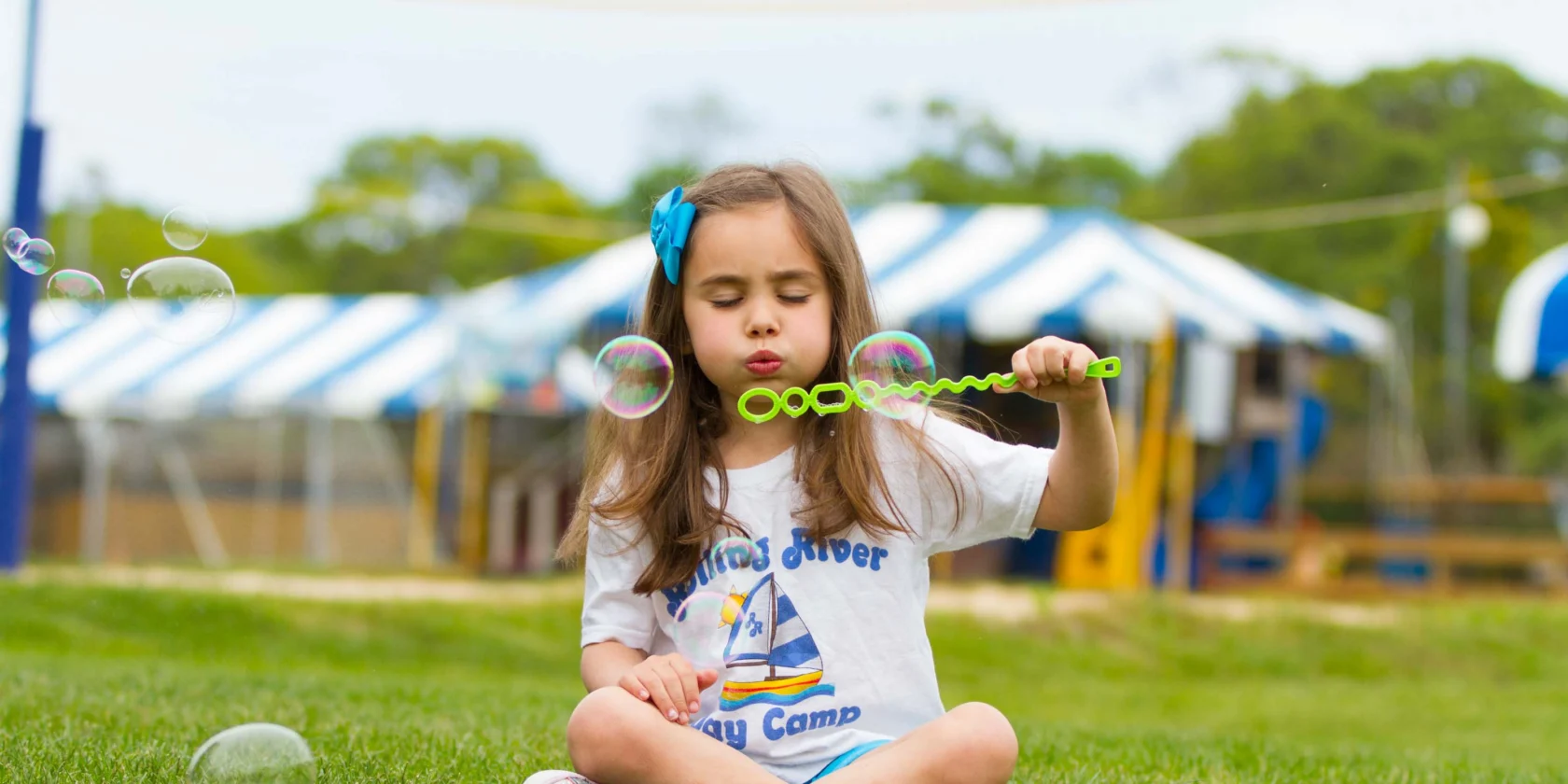 A camper blowing bubbles.